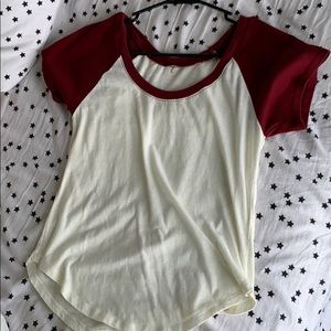 white tee with maroon sleeves and neck